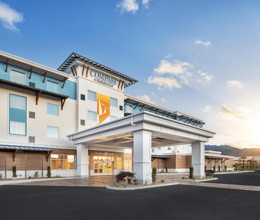 a rendering of the front of a hotel at Compass by Margaritaville Medford in Medford