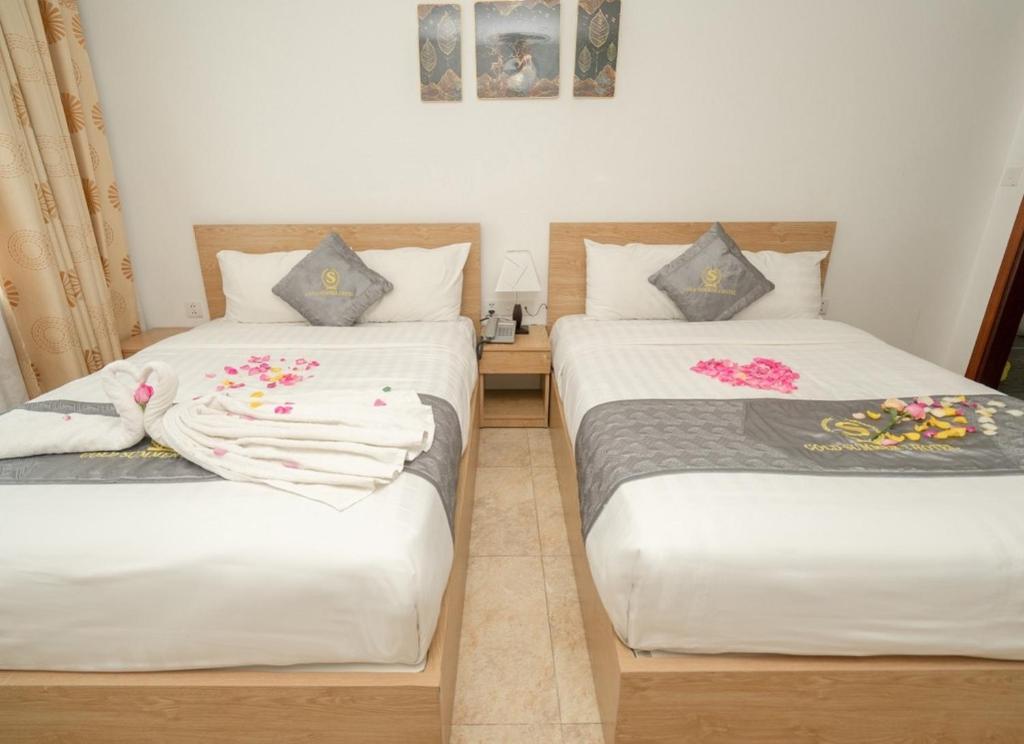 Postel nebo postele na pokoji v ubytování Gold Summer 2 Hotel