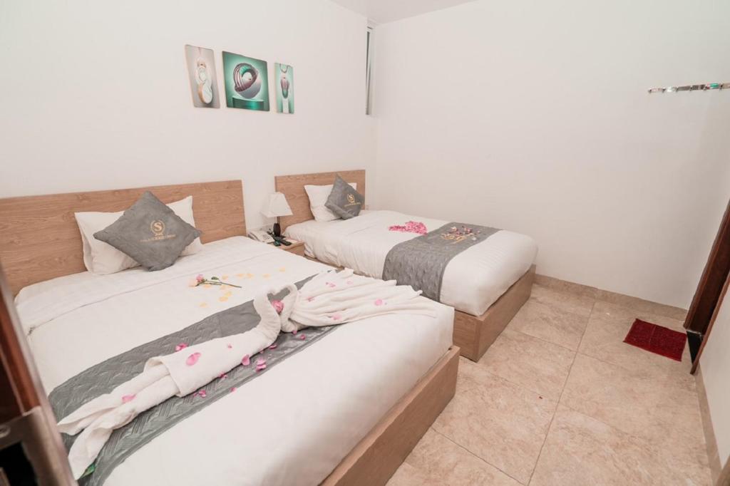 Postel nebo postele na pokoji v ubytování Gold Summer 2 Hotel