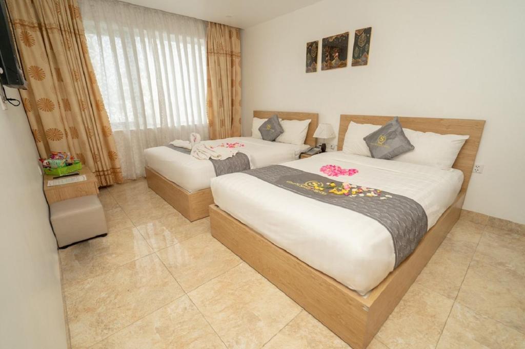 Postel nebo postele na pokoji v ubytování Gold Summer 2 Hotel