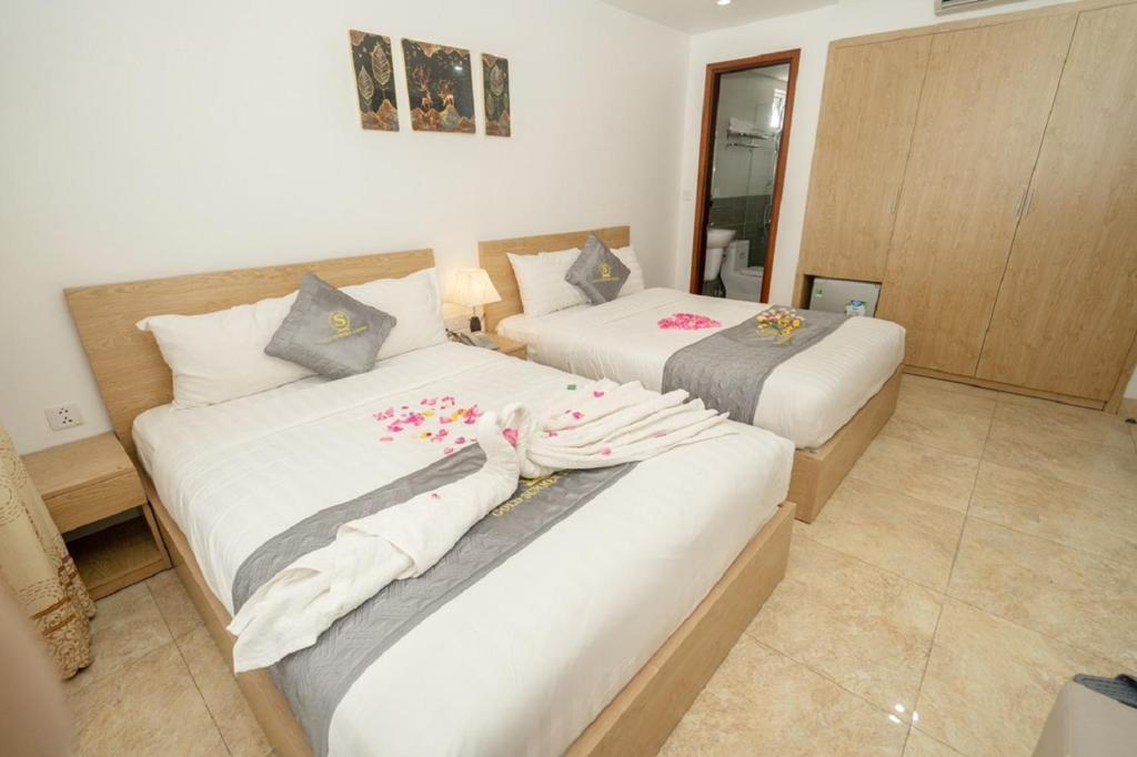 Postel nebo postele na pokoji v ubytování Gold Summer 2 Hotel