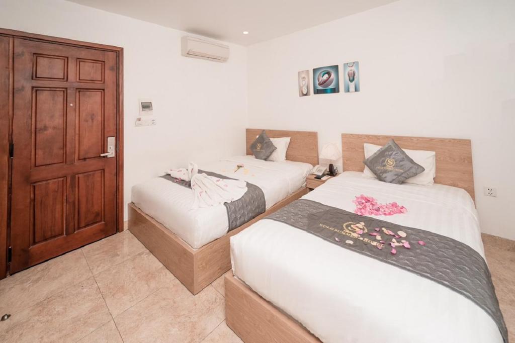 Postel nebo postele na pokoji v ubytování Gold Summer 2 Hotel