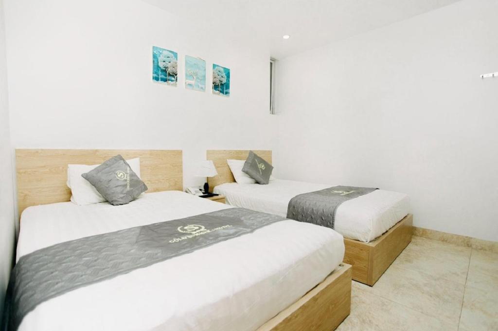 Postel nebo postele na pokoji v ubytování Gold Summer 2 Hotel