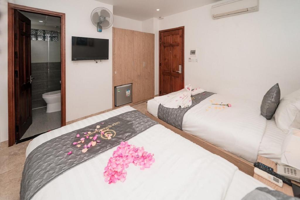 Postel nebo postele na pokoji v ubytování Gold Summer 2 Hotel