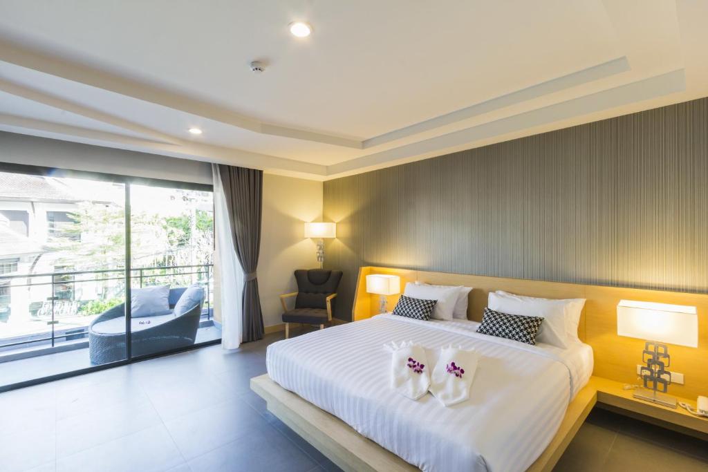 Postel nebo postele na pokoji v ubytování The Capuchin Hotel Krabi, Ao Nang Beach
