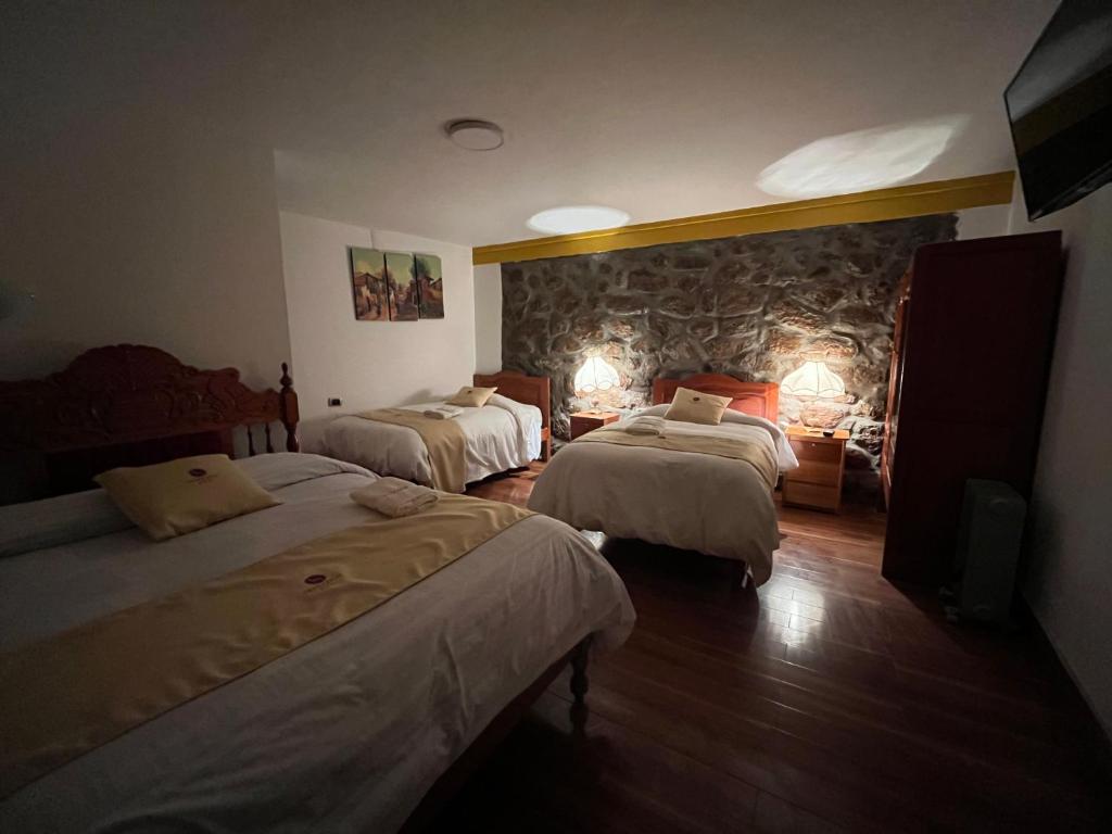 Postel nebo postele na pokoji v ubytování Hotel Choquequirao