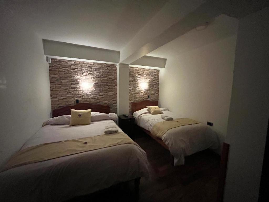 Postel nebo postele na pokoji v ubytování Hotel Choquequirao
