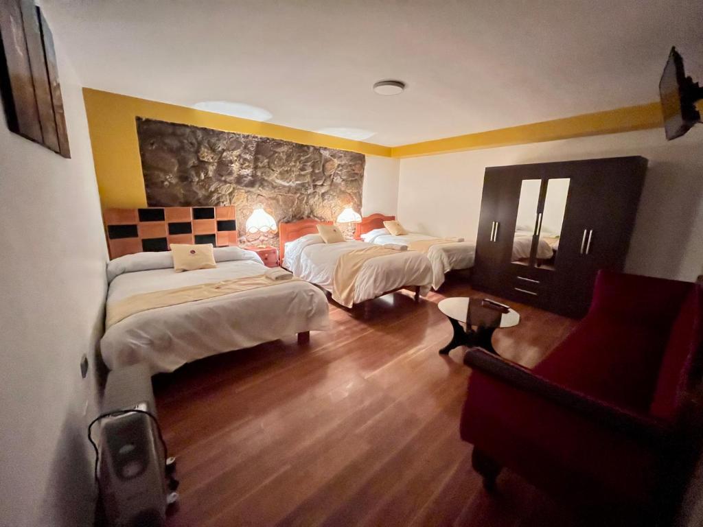 Postel nebo postele na pokoji v ubytování Hotel Choquequirao