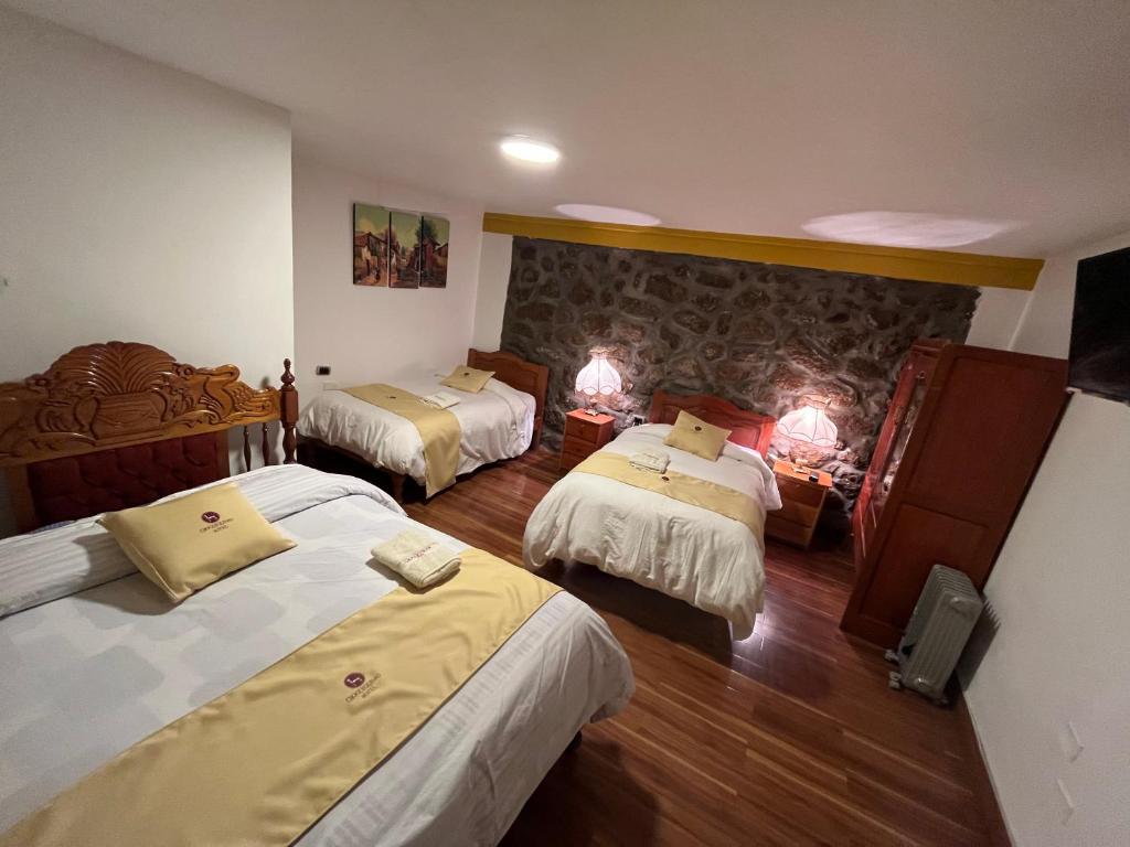 Postel nebo postele na pokoji v ubytování Hotel Choquequirao
