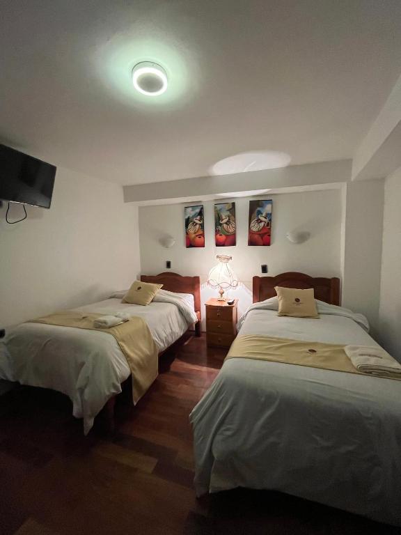 Postel nebo postele na pokoji v ubytování Hotel Choquequirao