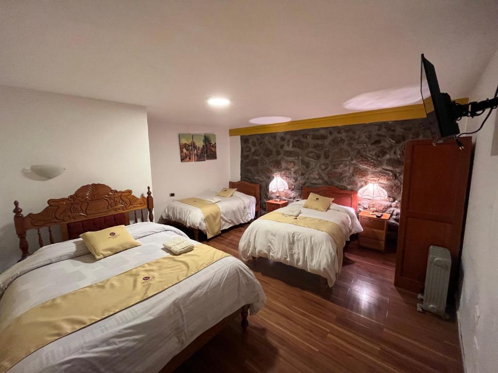 Postel nebo postele na pokoji v ubytování Hotel Choquequirao