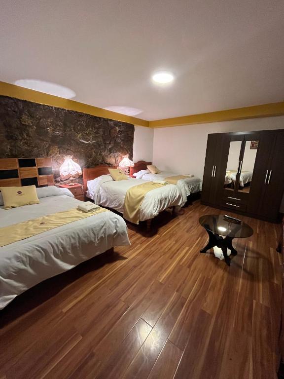 Postel nebo postele na pokoji v ubytování Hotel Choquequirao