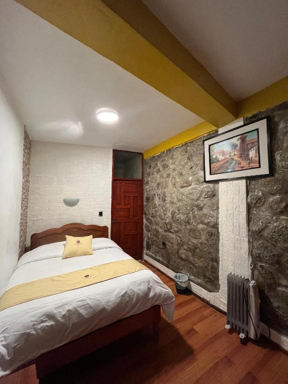 Postel nebo postele na pokoji v ubytování Hotel Choquequirao