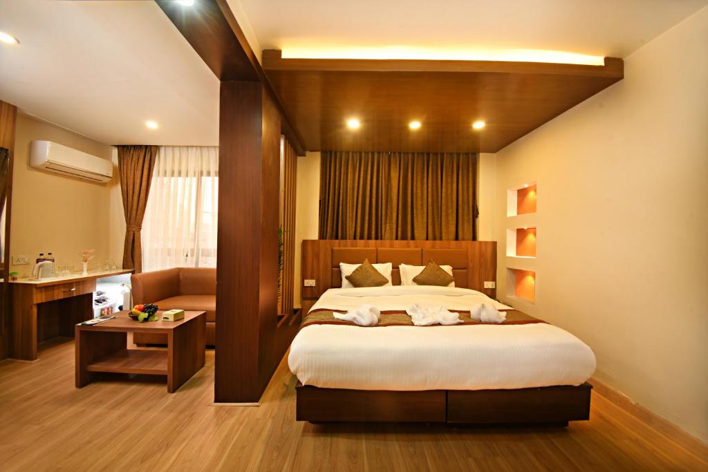 Postel nebo postele na pokoji v ubytování Capital Boutique Hotel