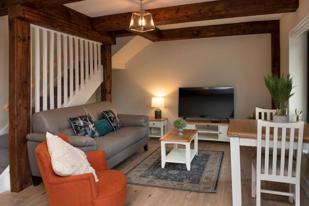 TV a/nebo společenská místnost v ubytování K2Cottages