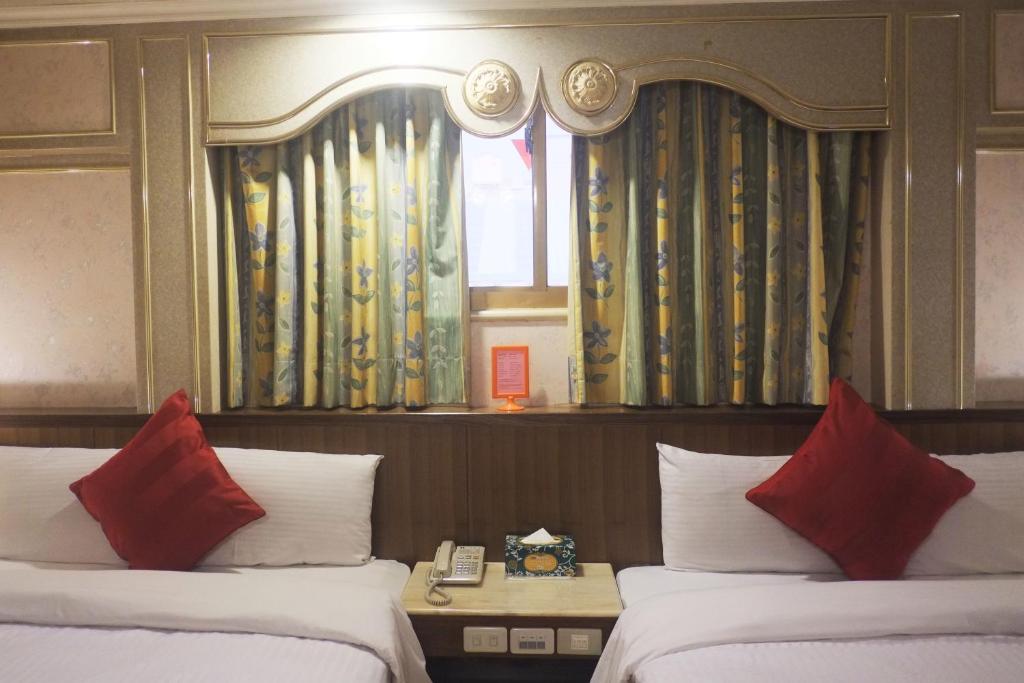 Postel nebo postele na pokoji v ubytování Fu Chang Hotel
