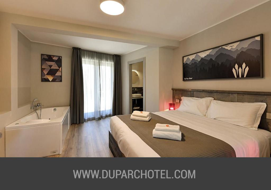 Posteľ alebo postele v izbe v ubytovaní Du Parc Hotel
