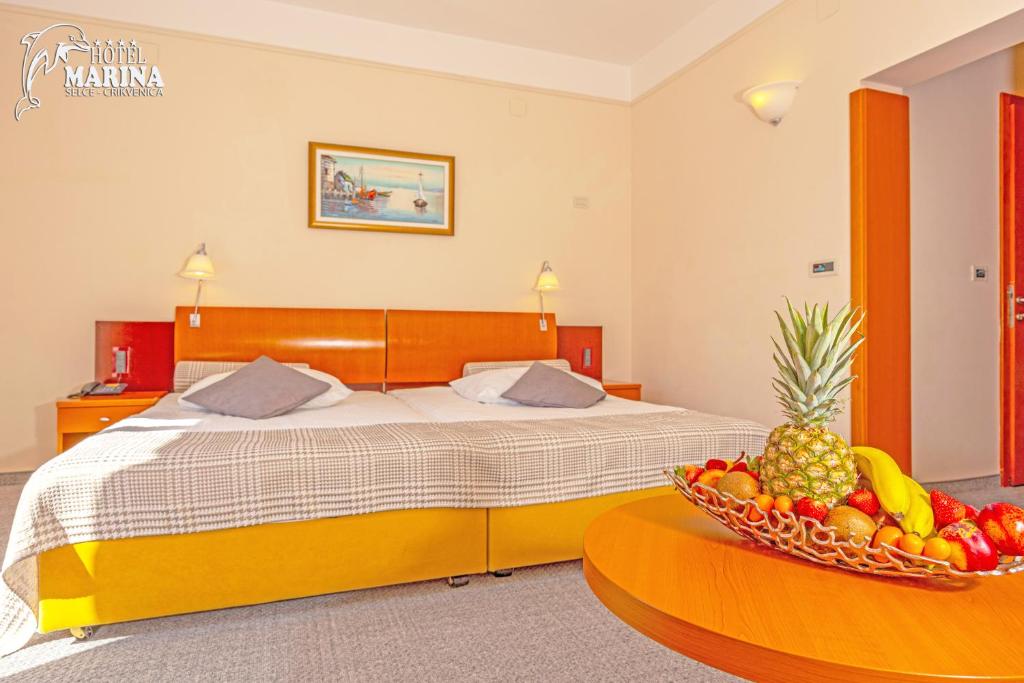 Postel nebo postele na pokoji v ubytování Hotel Marina