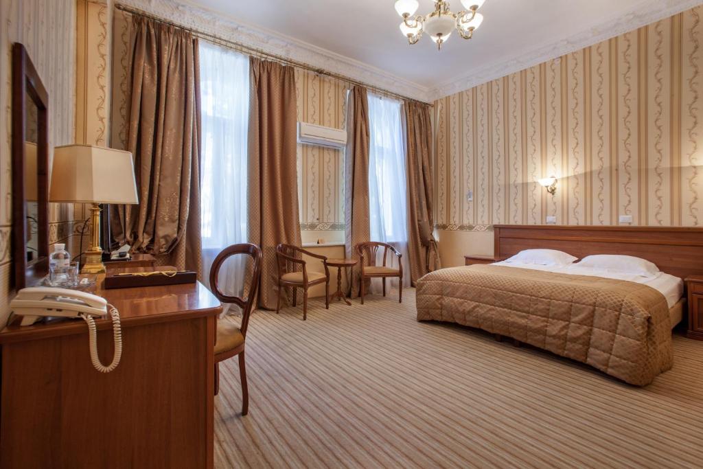 Postel nebo postele na pokoji v ubytování Londonska SPA Hotel