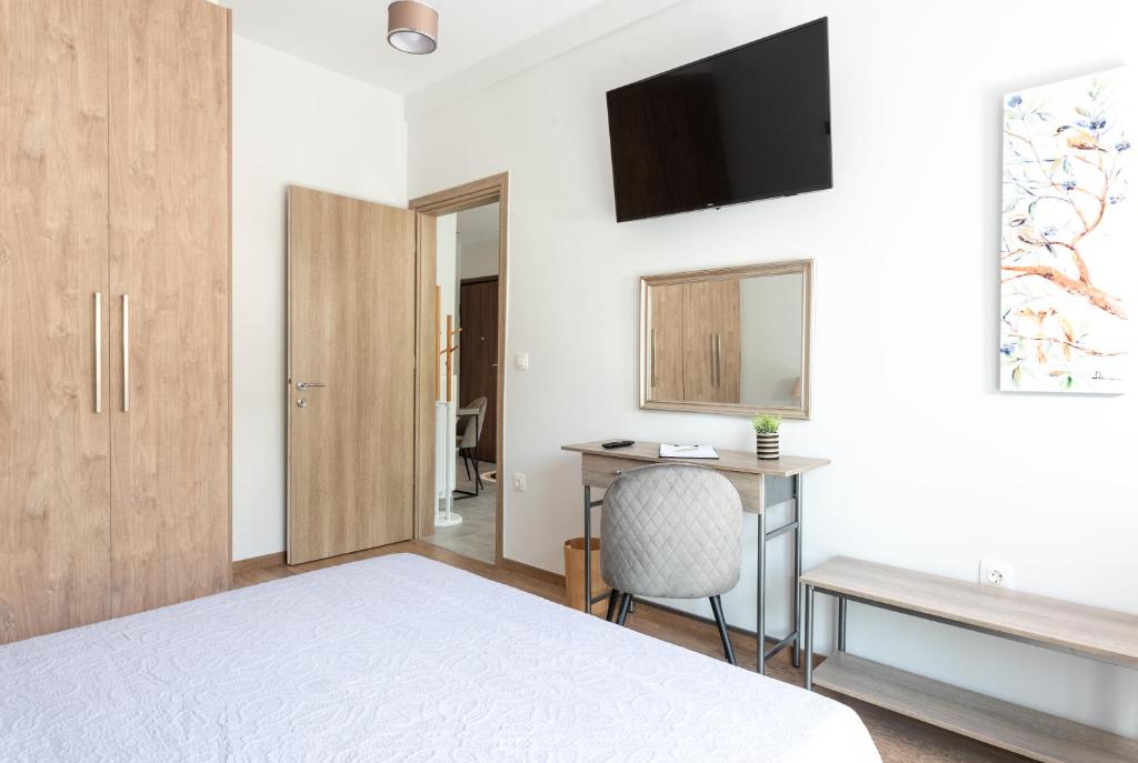 Televízia a/alebo spoločenská miestnosť v ubytovaní Cozy Corner - Central Stylish Apartment