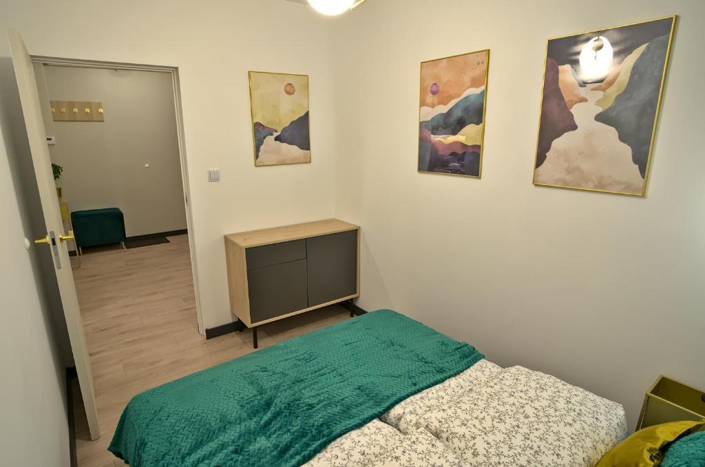 Posteľ alebo postele v izbe v ubytovaní Apartament Witold