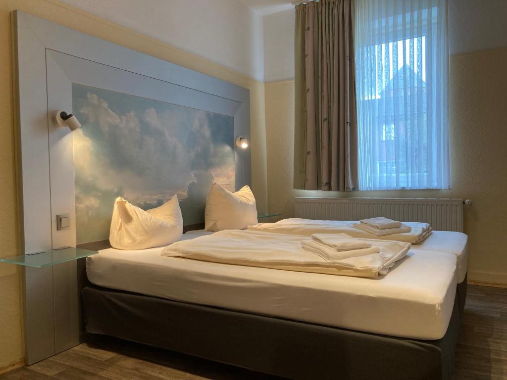 Postel nebo postele na pokoji v ubytování Landhotel Vosse-Schepers