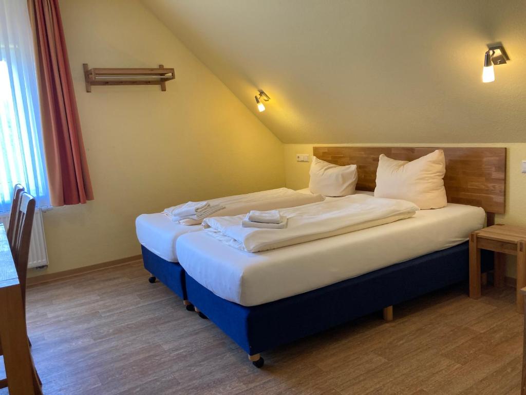 Postel nebo postele na pokoji v ubytování Landhotel Vosse-Schepers