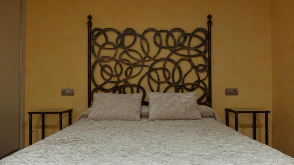 Posteľ alebo postele v izbe v ubytovaní Hotel Albergue La Casa Del Peregrino