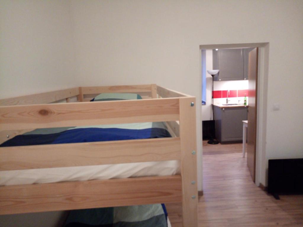 Postel nebo postele na pokoji v ubytování Apartmány Na hrnčírně