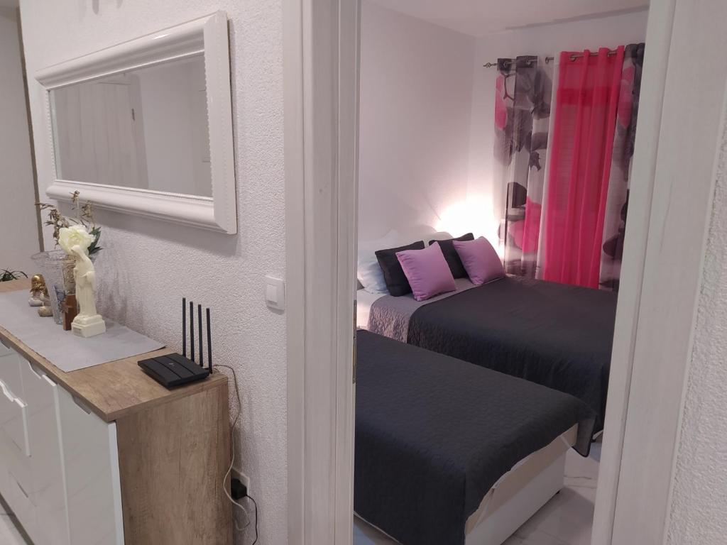 Posteľ alebo postele v izbe v ubytovaní Apartmani Trubi 3