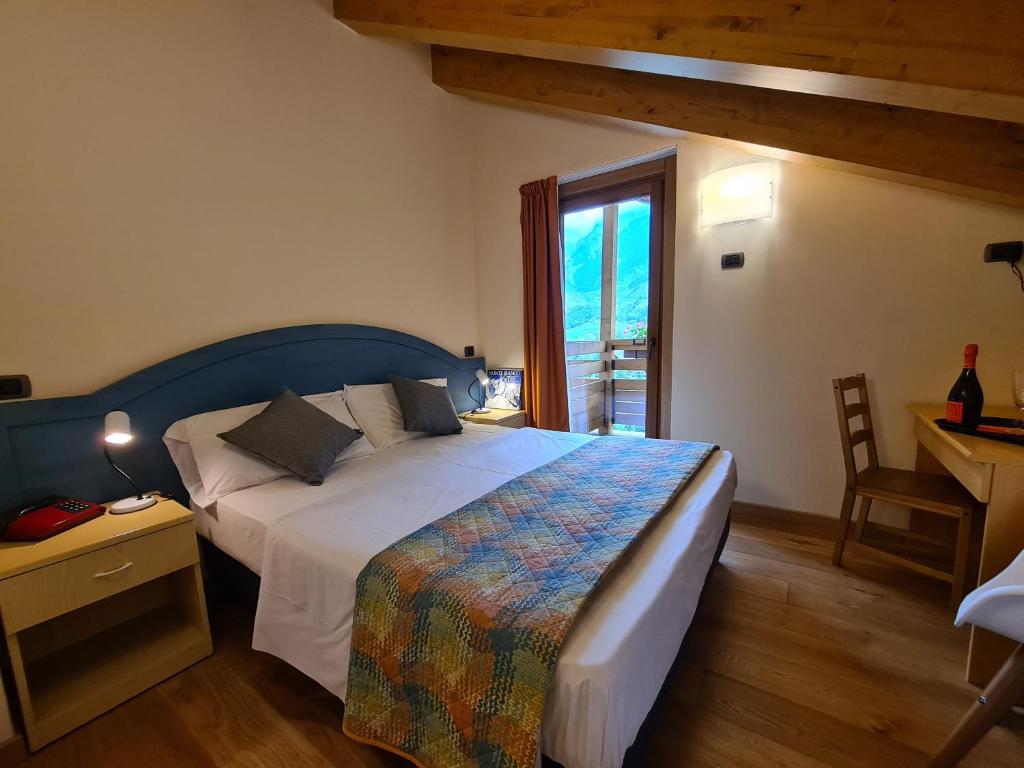 Postel nebo postele na pokoji v ubytování Hotel Aigle