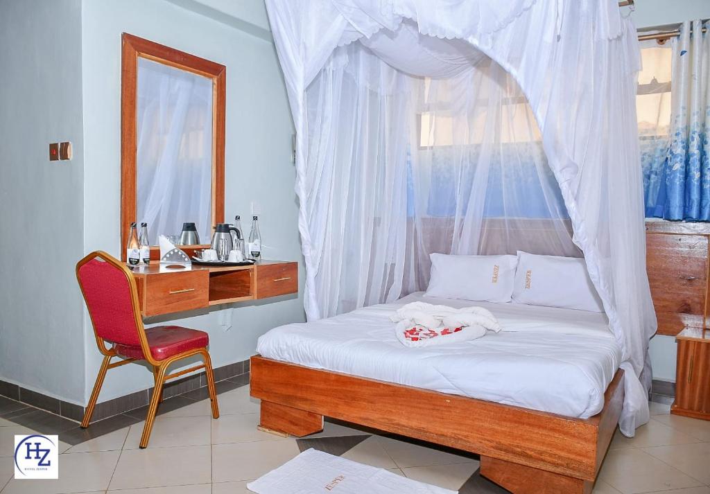 Postel nebo postele na pokoji v ubytování Hotel Zesper