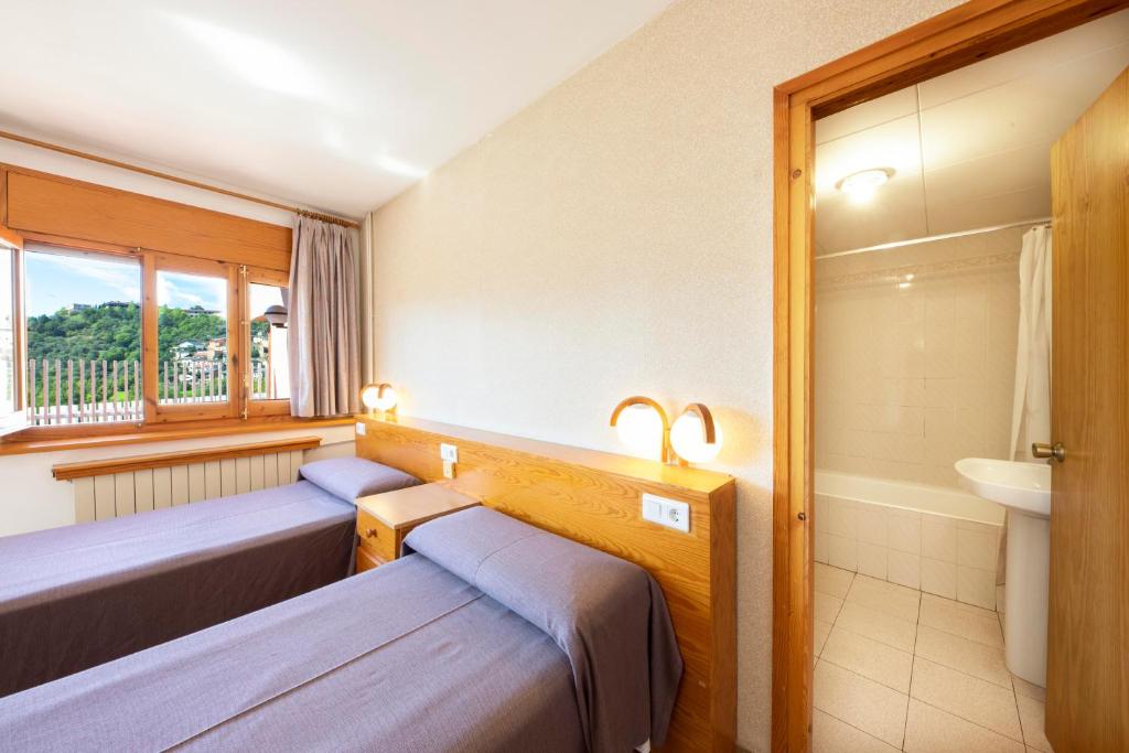 Postel nebo postele na pokoji v ubytování Hotel Restaurante La Glorieta