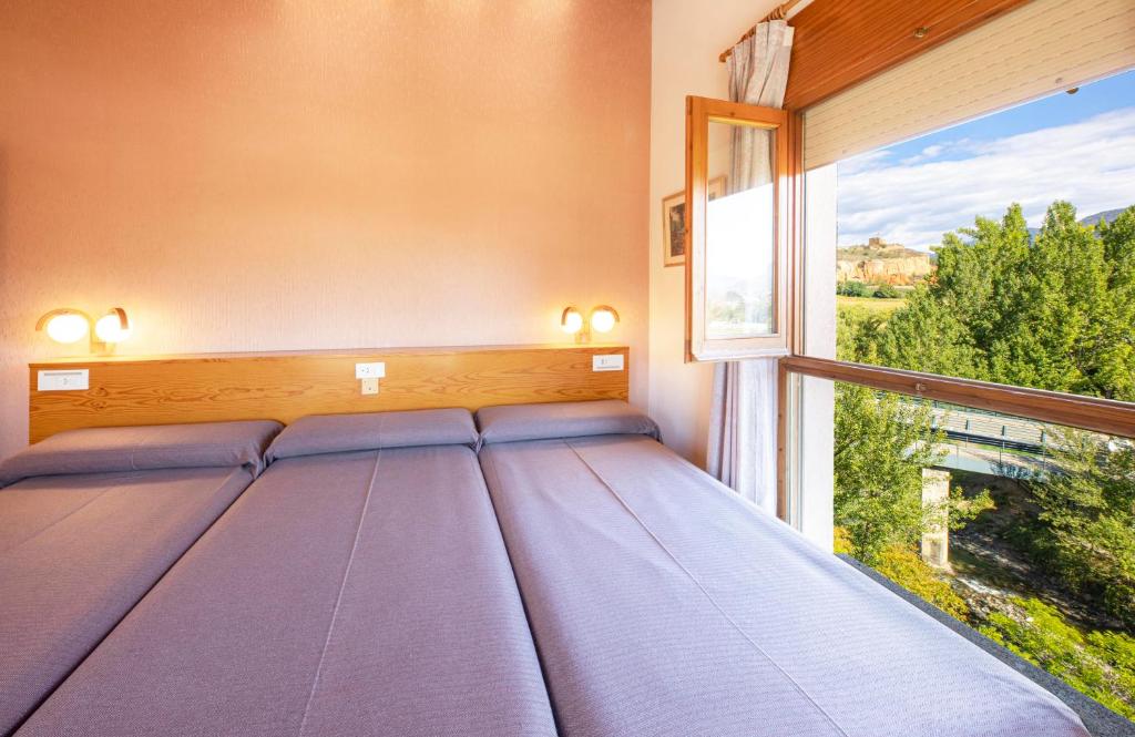 Postel nebo postele na pokoji v ubytování Hotel Restaurante La Glorieta