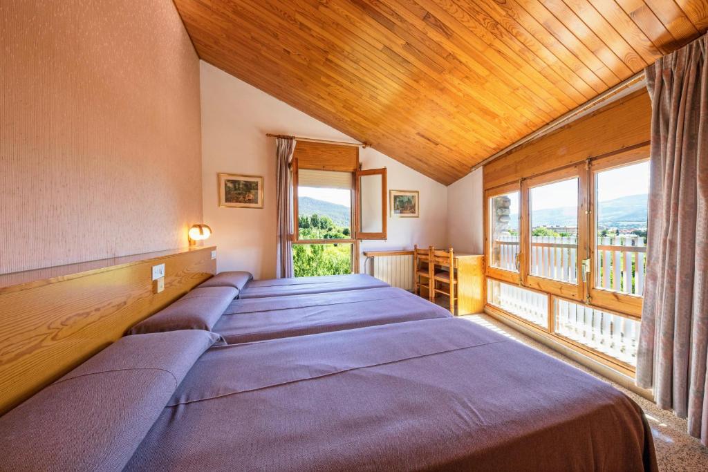 Postel nebo postele na pokoji v ubytování Hotel Restaurante La Glorieta