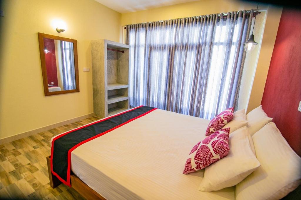 Postel nebo postele na pokoji v ubytování Athithi Villa