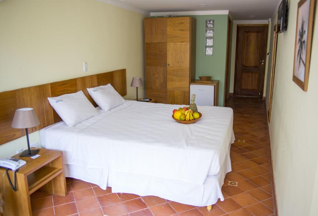 Postel nebo postele na pokoji v ubytování Hotel Cruz do Pascoal