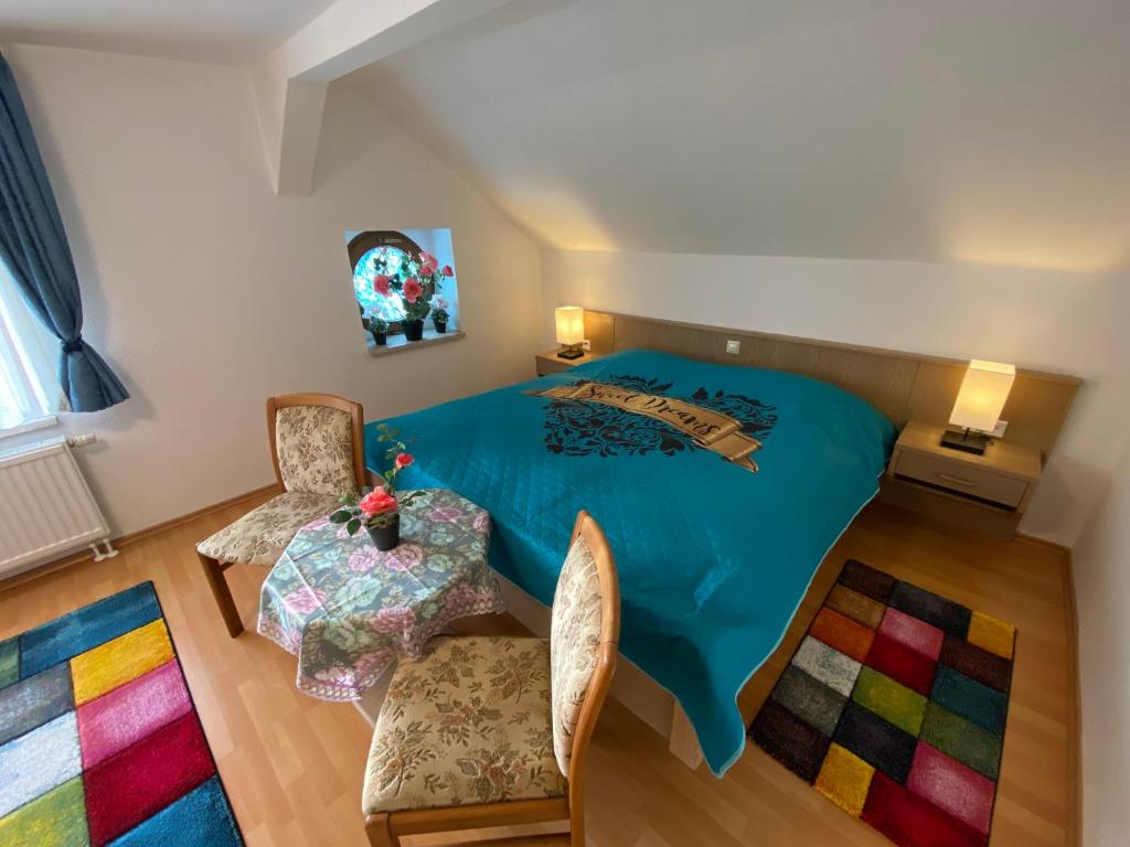 Postel nebo postele na pokoji v ubytování Hotel Bielatal