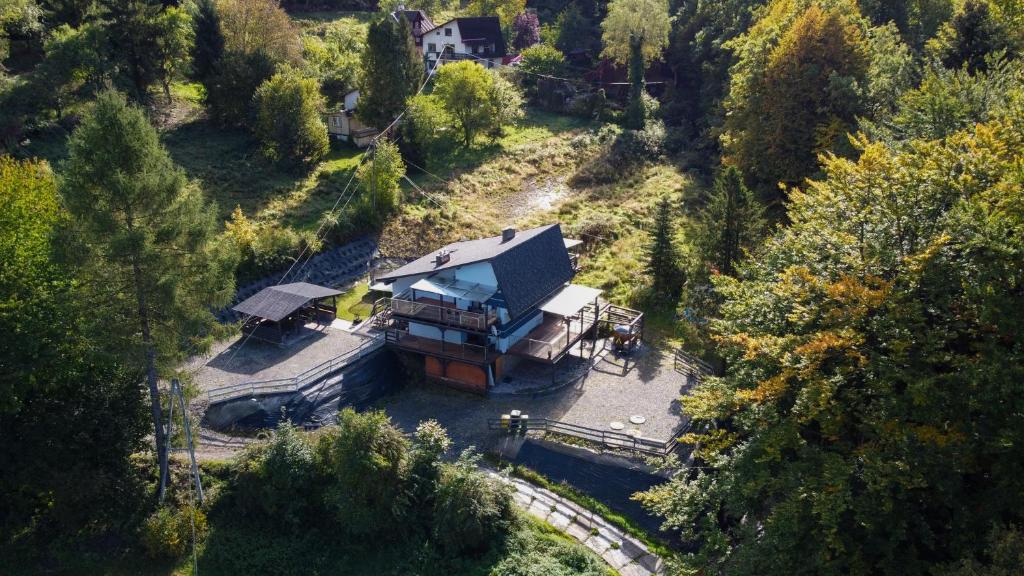 an aerial view of a large house in a forest at Apartamenty Sun & Snow Siedlisko Palenica in Ustroń