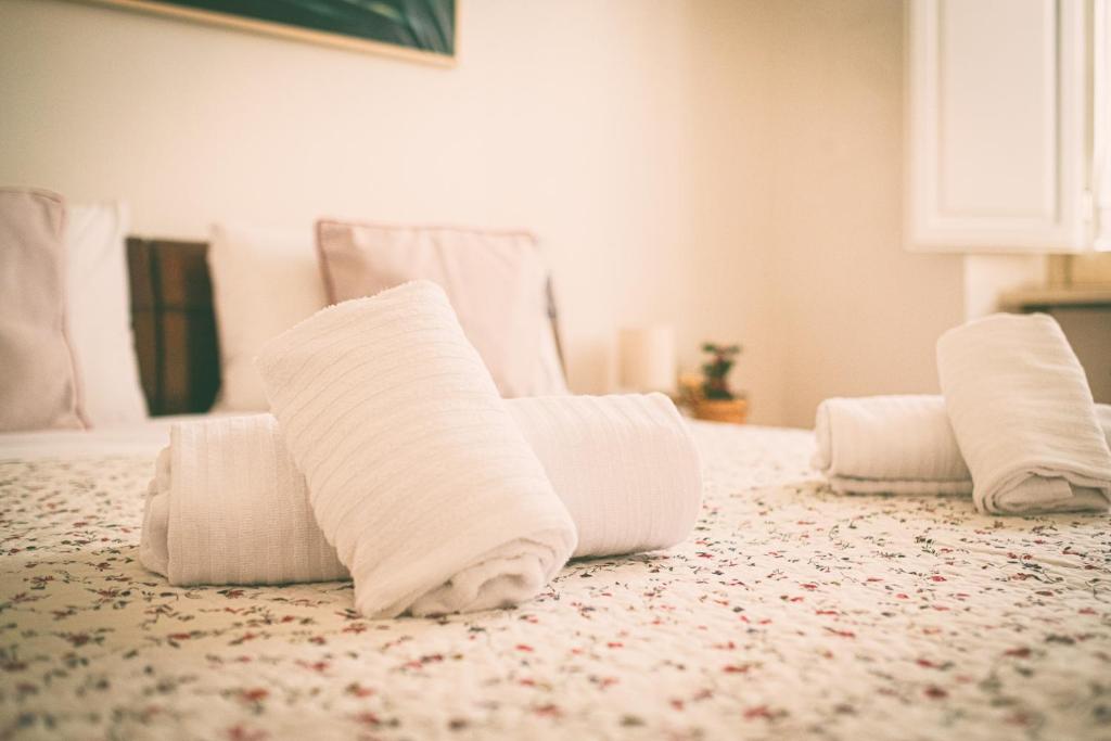 Posteľ alebo postele v izbe v ubytovaní HT Laterano Apartment