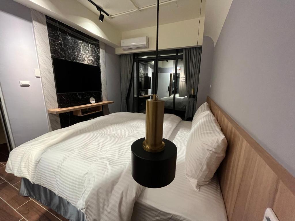 Postel nebo postele na pokoji v ubytování 飛鳥集行館
