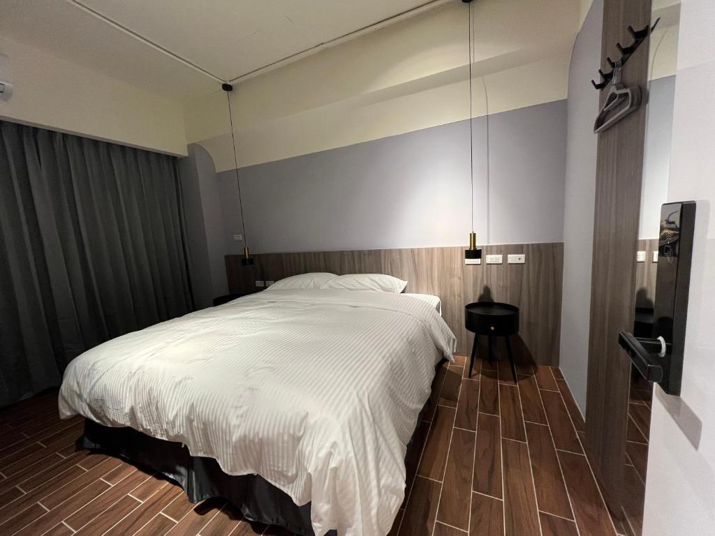 Postel nebo postele na pokoji v ubytování 飛鳥集行館