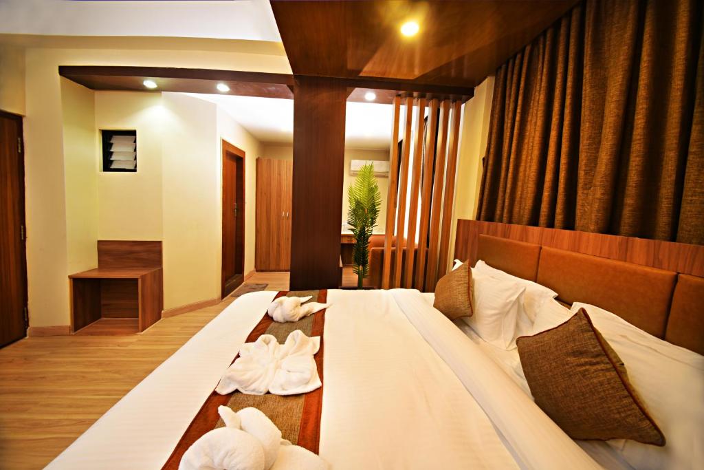 Postel nebo postele na pokoji v ubytování Capital Boutique Hotel