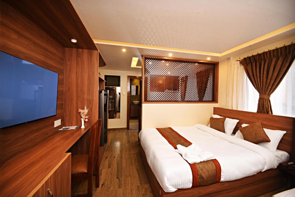 Postel nebo postele na pokoji v ubytování Capital Boutique Hotel