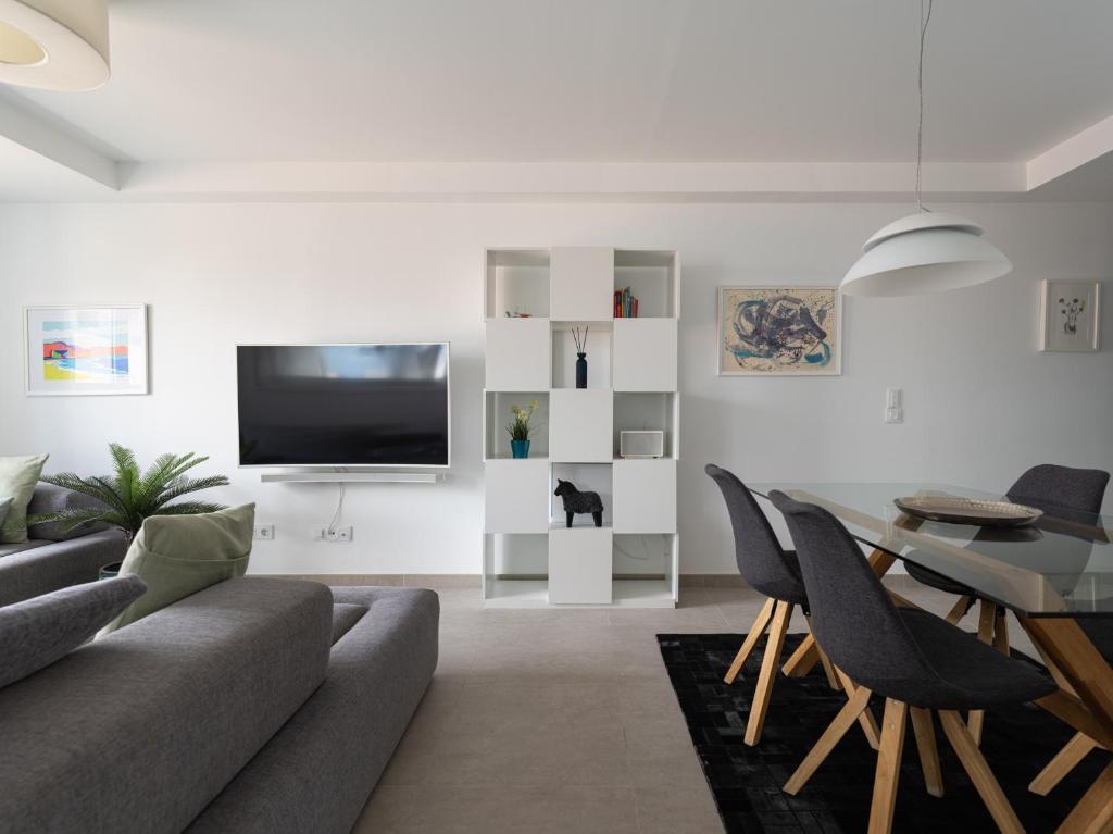 A television and/or entertainment centre at Leyre Mar Canteras by Canariasgetaway
