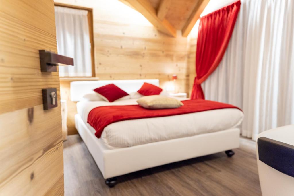 Ένα ή περισσότερα κρεβάτια σε δωμάτιο στο Chalet Imbosc'chè