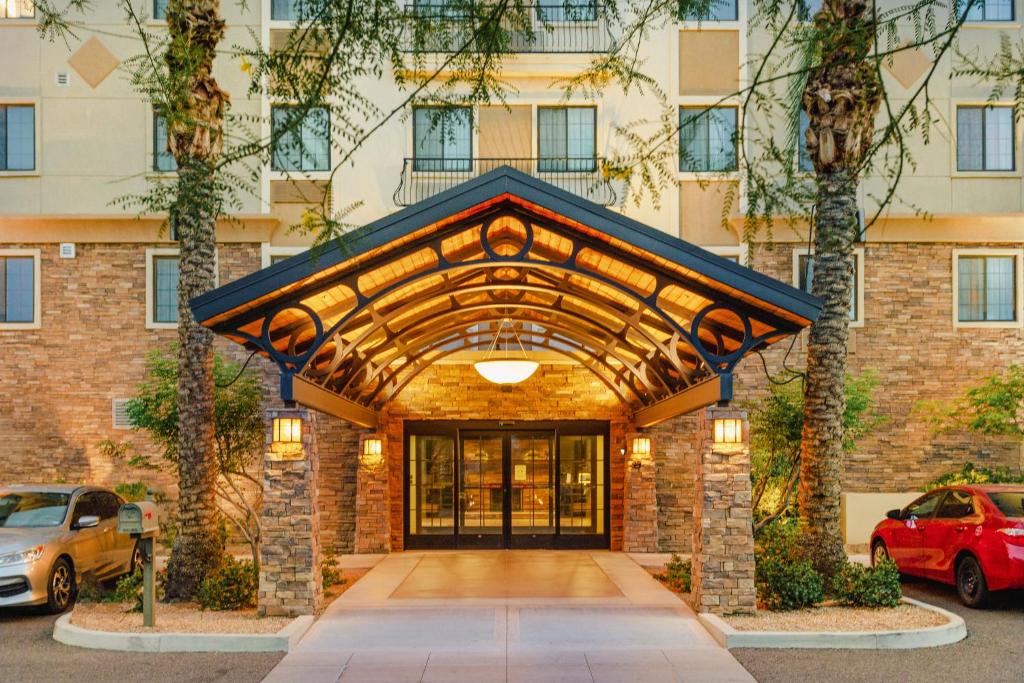 a brick building with a large entry door at Staybridge Suites Chandler, an IHG Hotel in Chandler