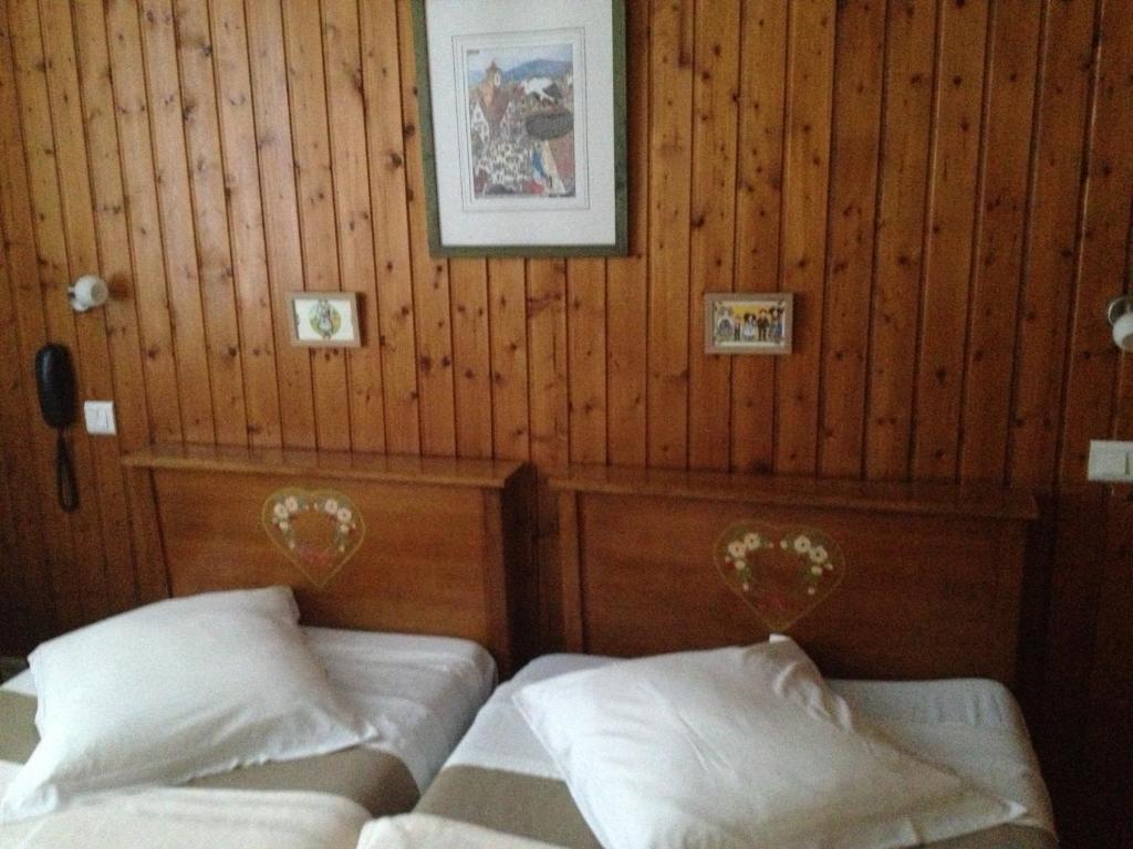 Postel nebo postele na pokoji v ubytování Hôtel Restaurant Wolf