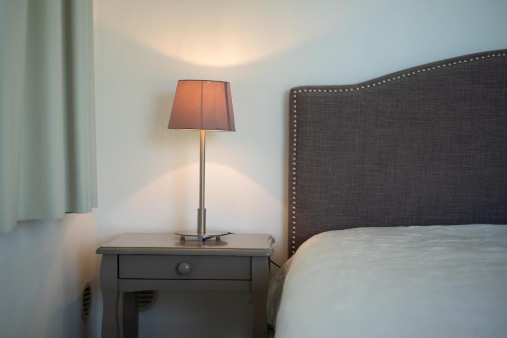 Кровать или кровати в номере La Citadelle Appartements