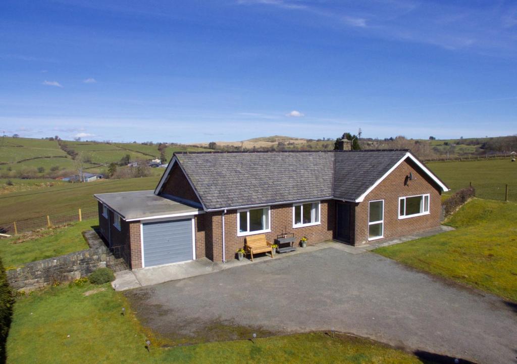 an aerial view of a house with a garage at Glan Donau in Llanuwchllyn